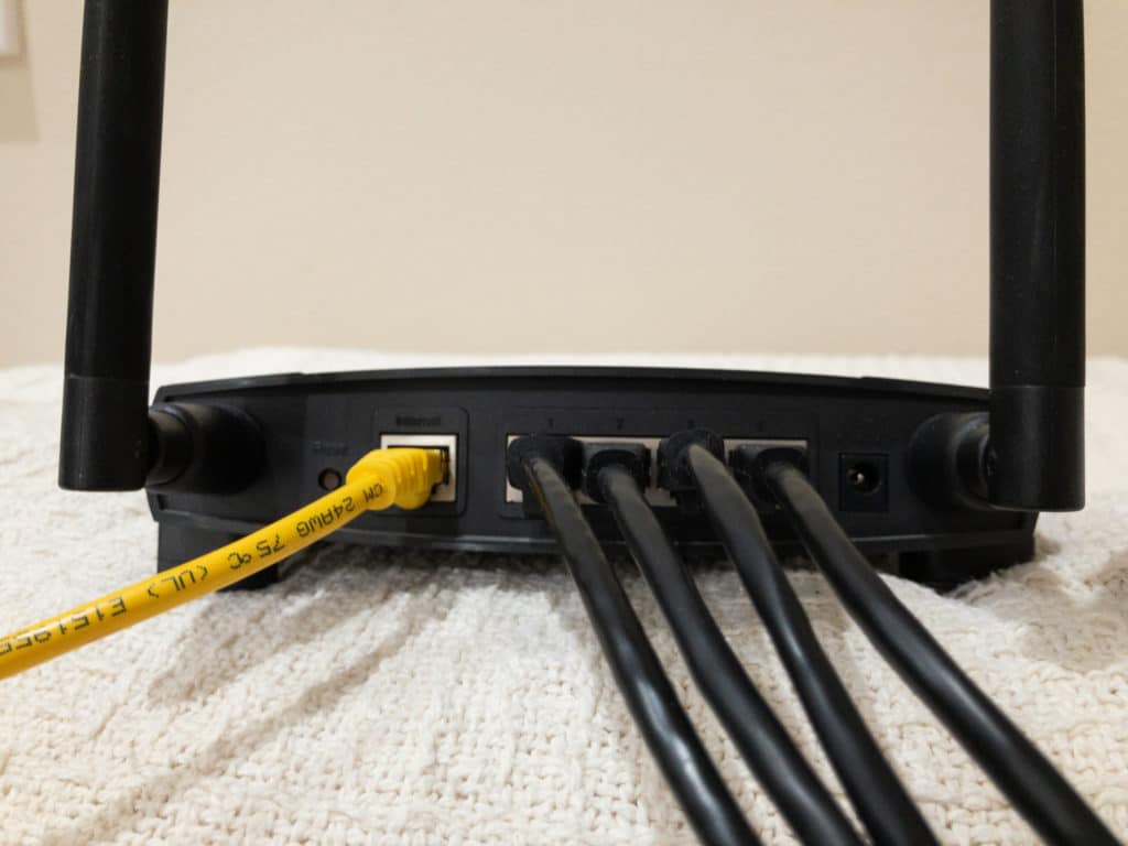 Ethernet ports on the back of a Wi-Fi router